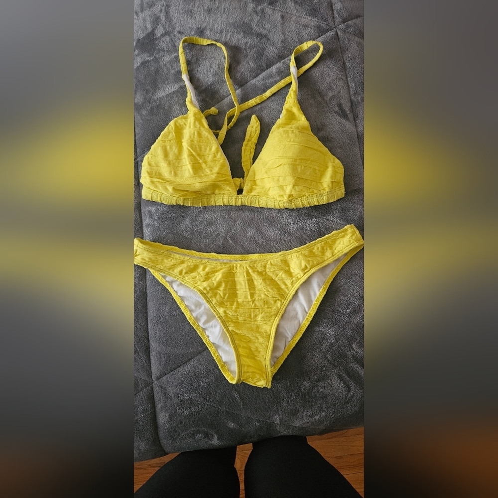 Womens 2 piece bathing suit in yellow slight raised texture.
